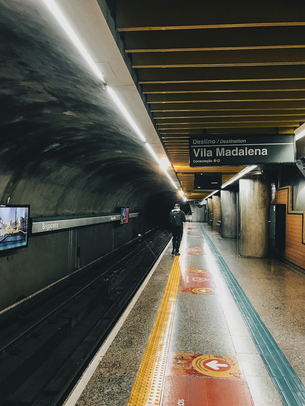 a train pulling into a train station next to a platform