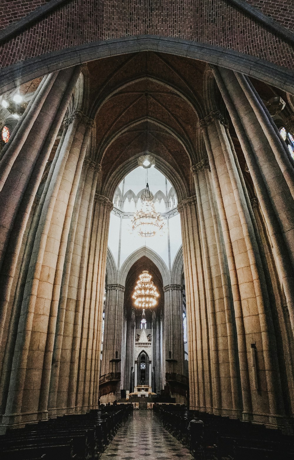 a large cathedral with a chandelier hanging from the ceiling