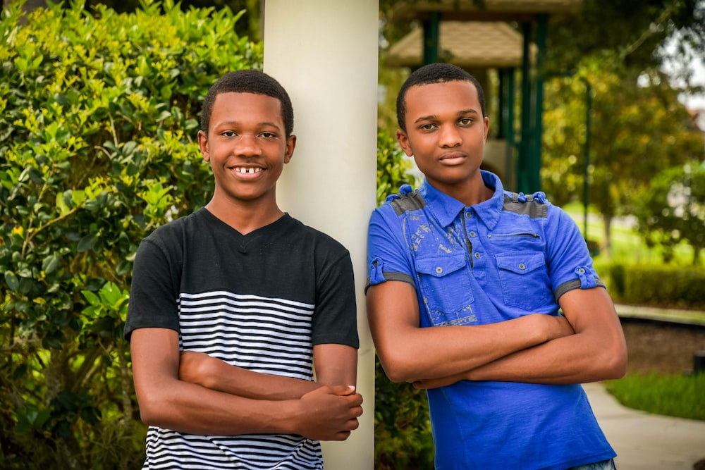 two young men standing next to each other