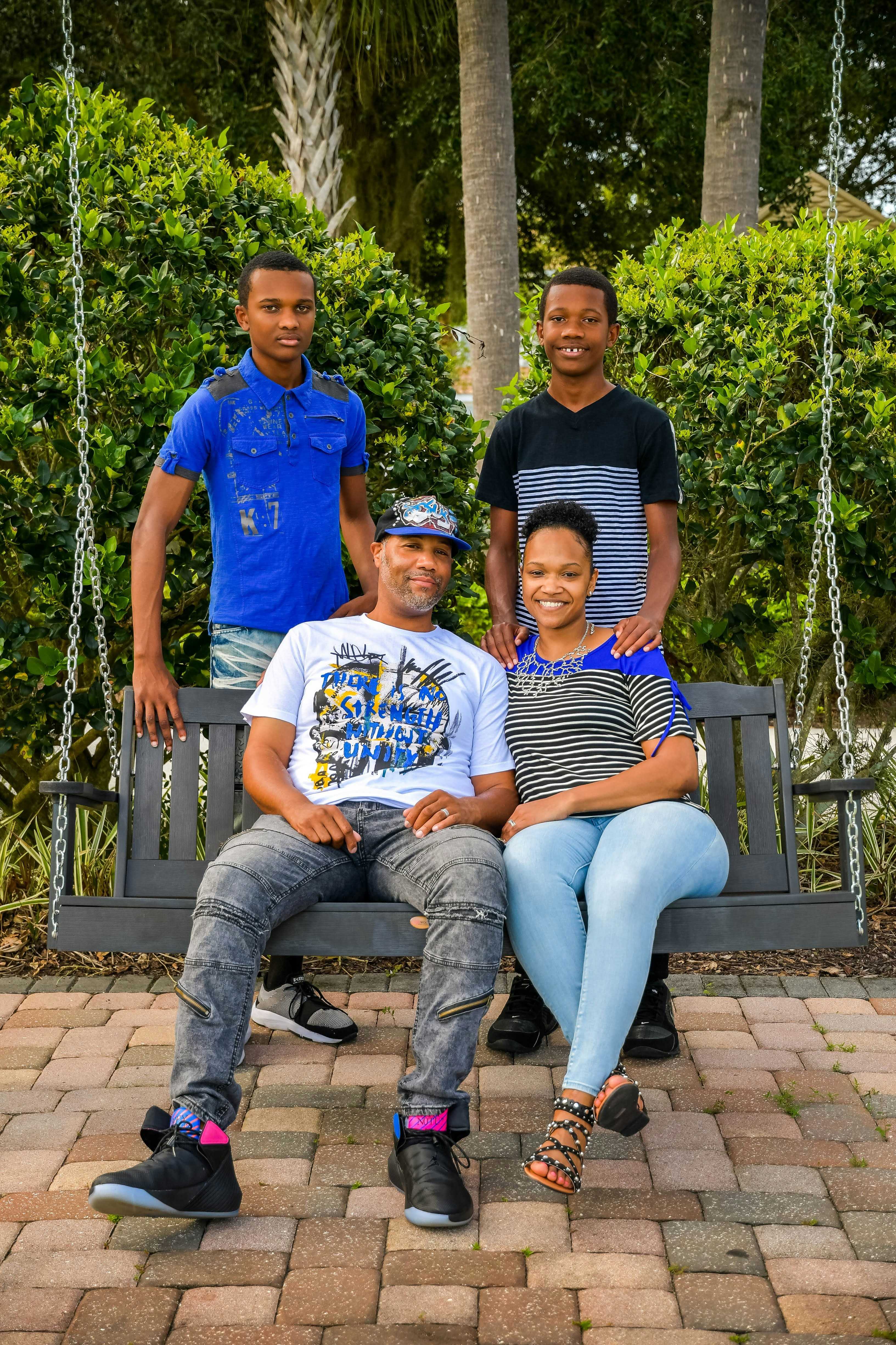 a group of people sitting on a swing