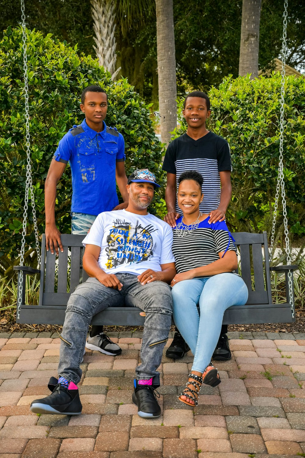 a group of people sitting on a swing