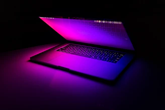 a laptop computer sitting on top of a table