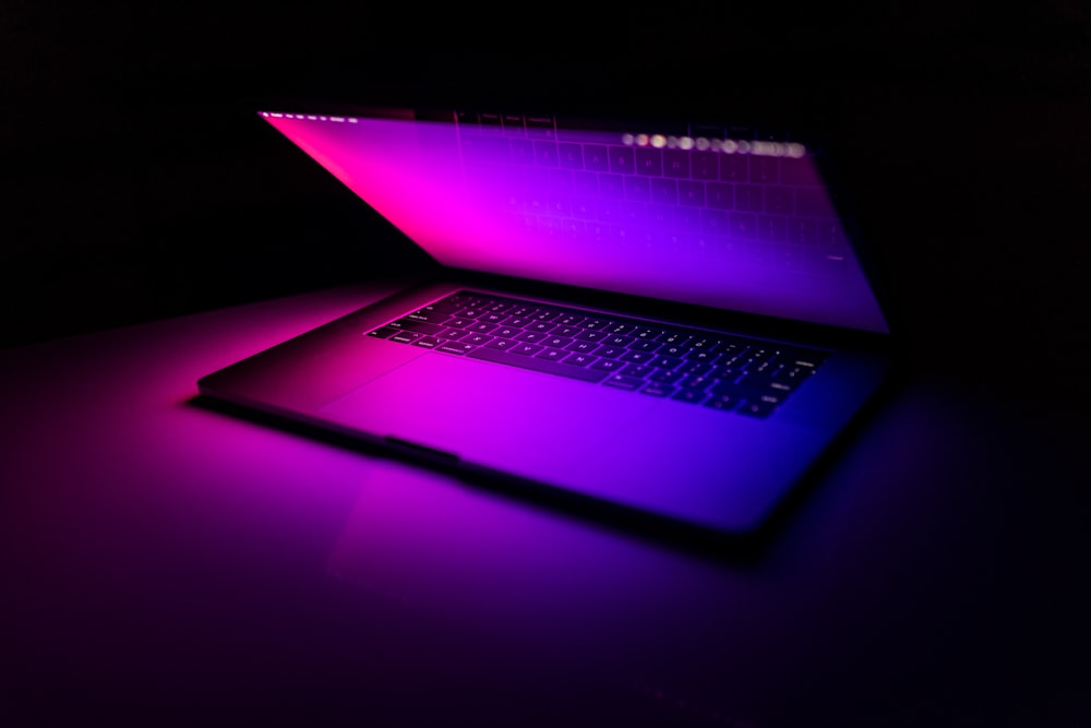 a laptop computer sitting on top of a table