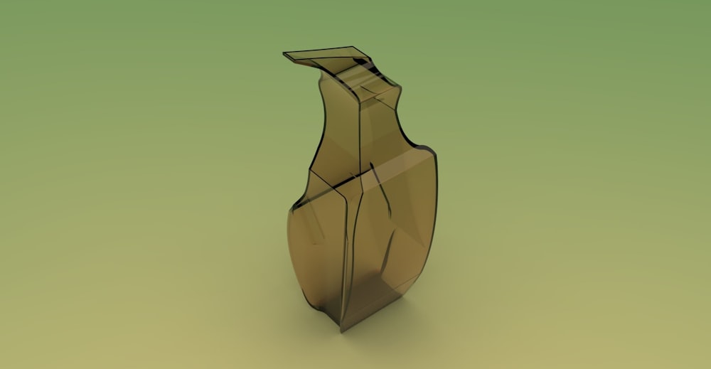 a brown vase sitting on top of a green surface