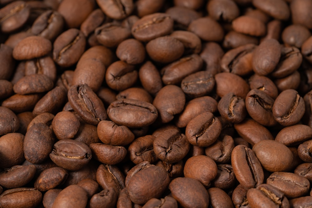 a pile of coffee beans that are brown
