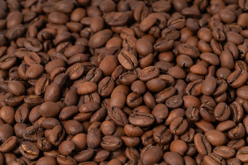 a pile of coffee beans sitting on top of each other