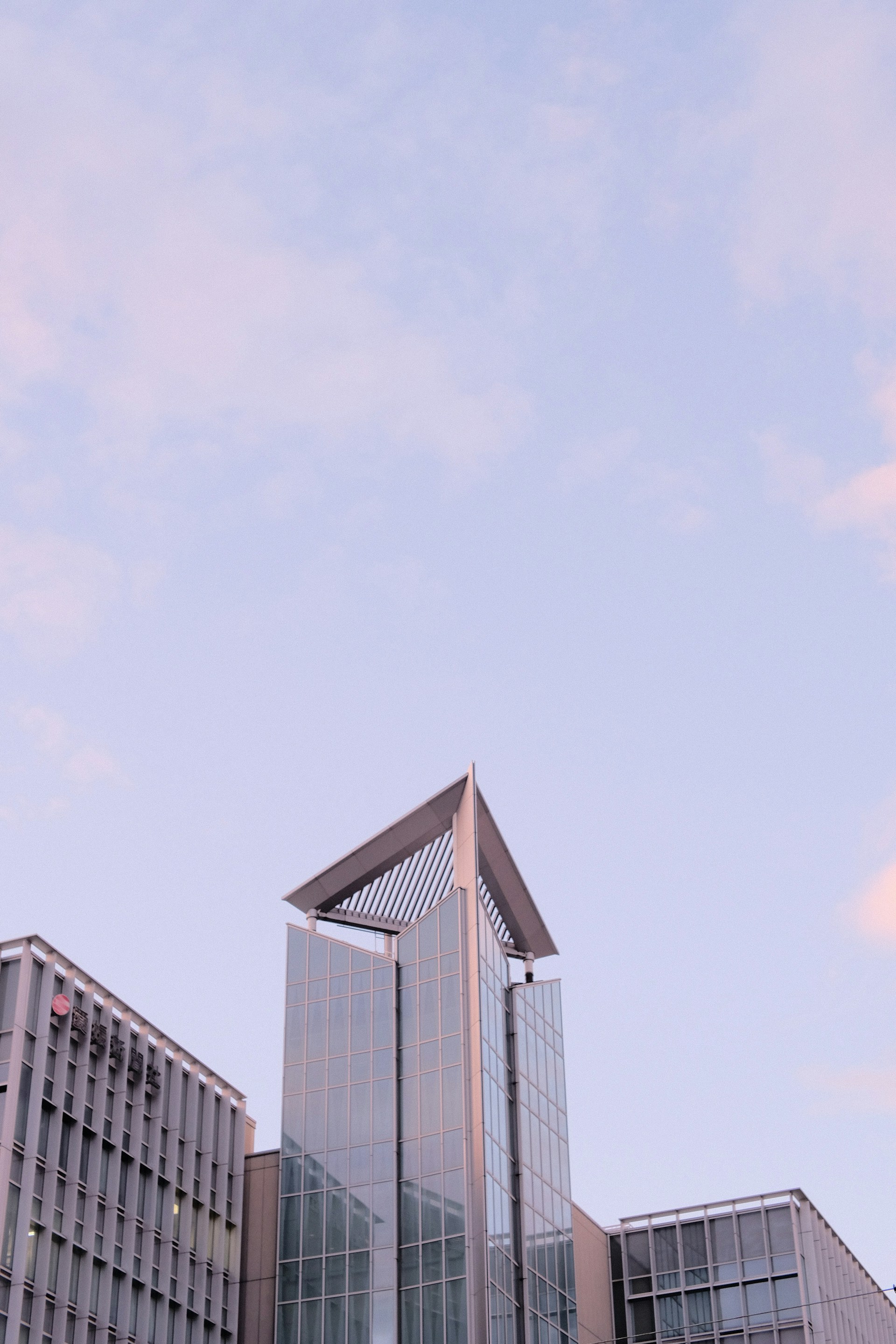 a tall building with a sky background