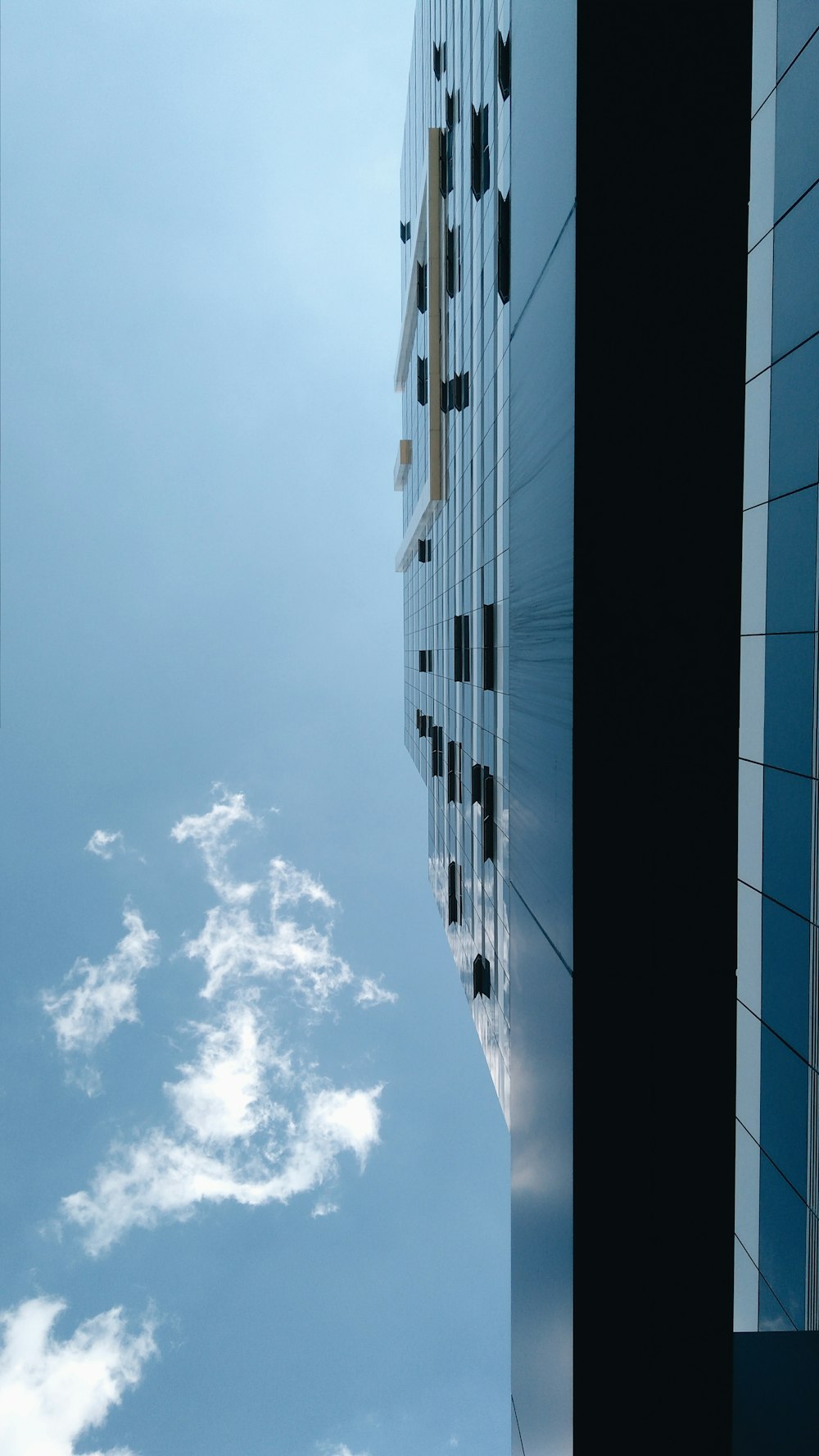 a very tall building with a sky background