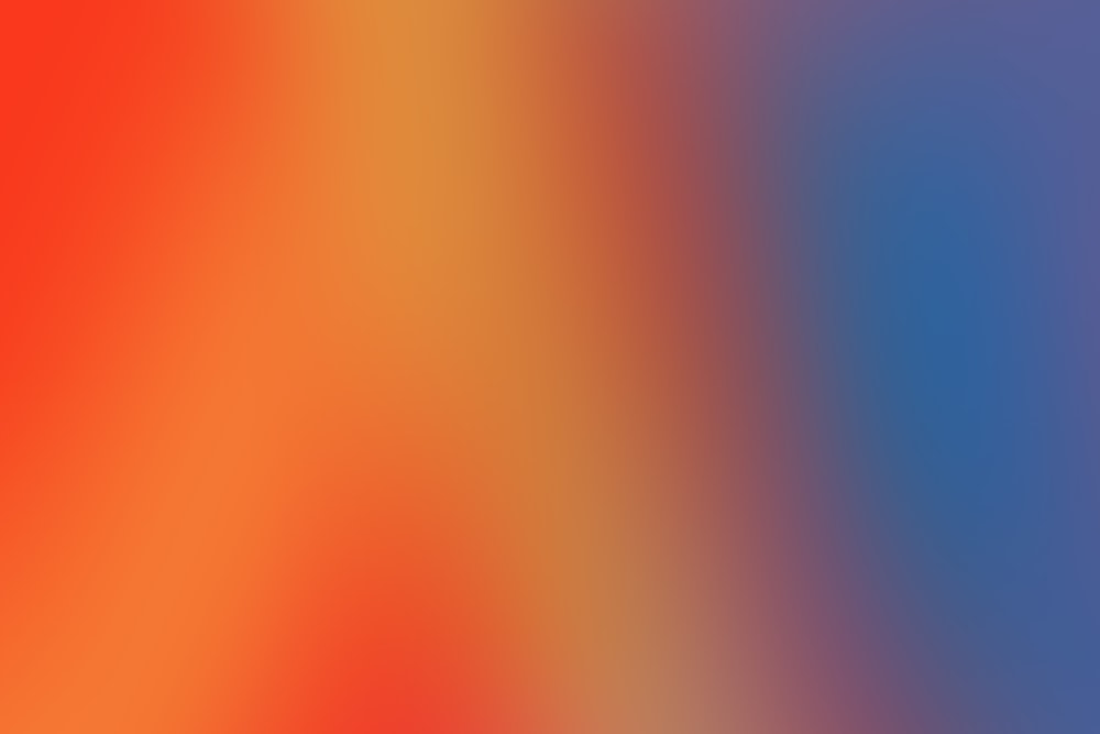 a blurry image of a red and blue background