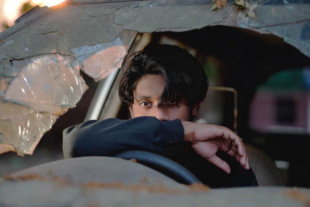 a man sitting in the back of a car