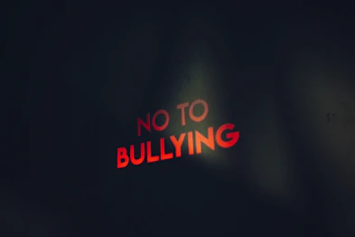 a red sign that says no to bullying