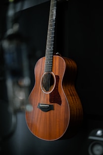 a guitar hanging on a wall in a room