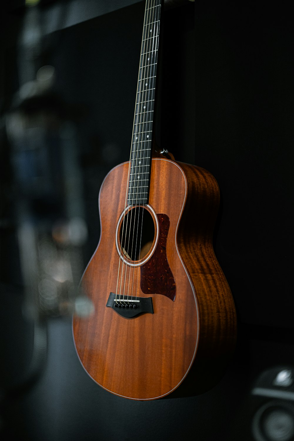 a guitar hanging on a wall in a room