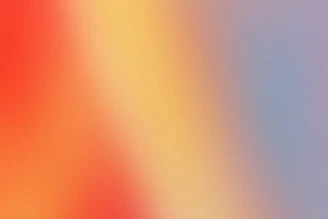 a blurry image of a red and yellow background