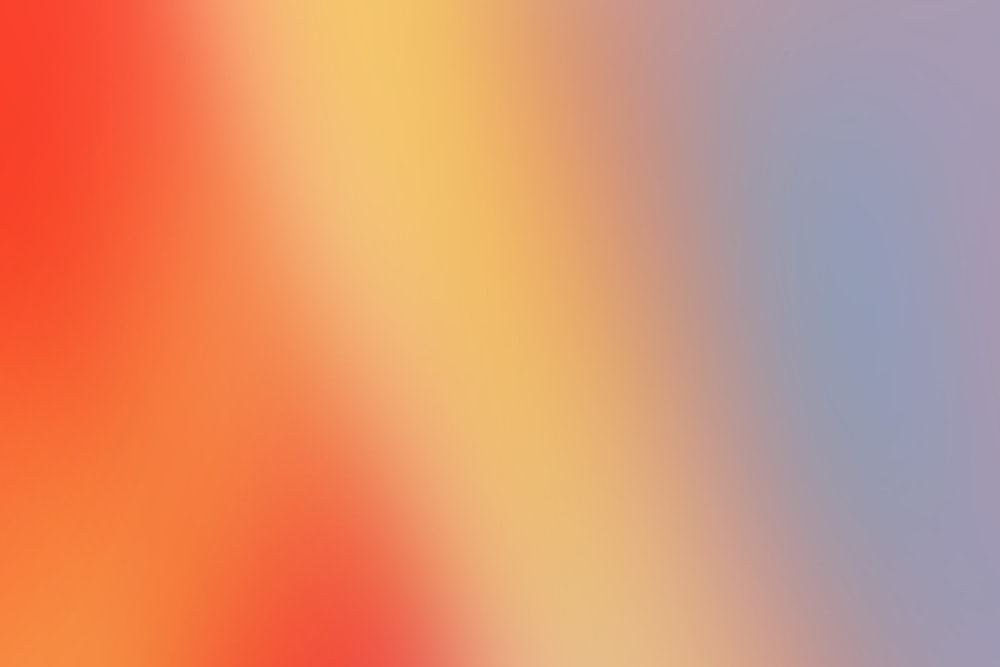 a blurry image of a red and yellow background