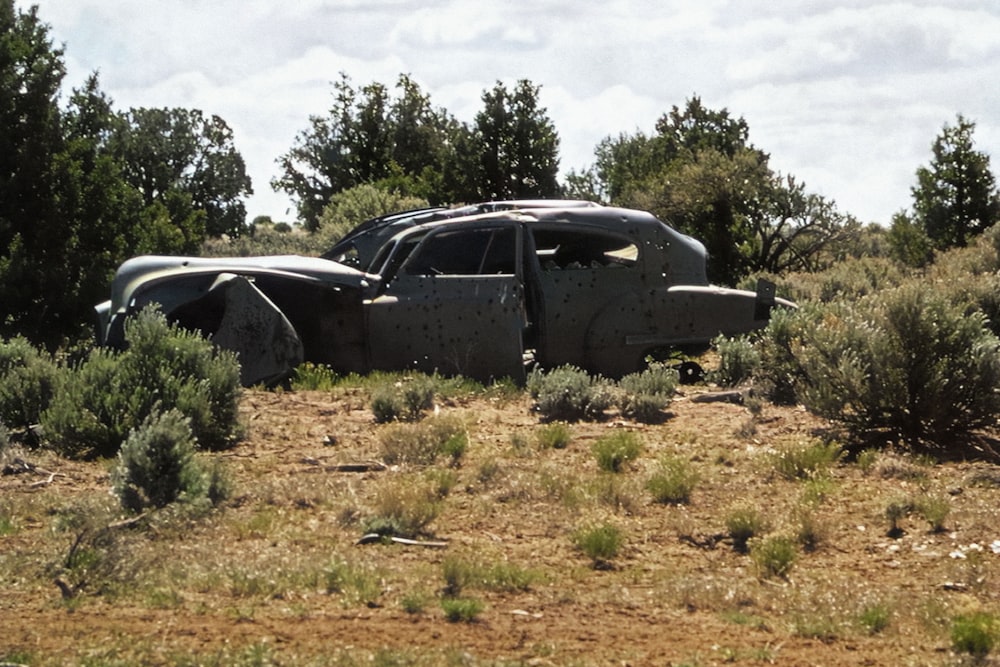 a car that is sitting in the dirt