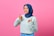 A smiling woman giving a thumbs up, showcasing her satisfaction with the influencer agency.