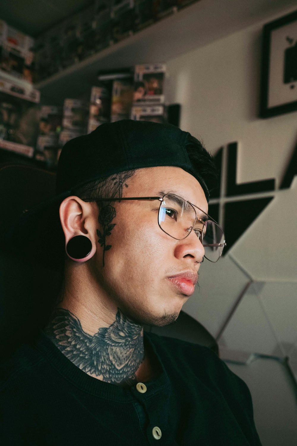 a man with tattoos and piercings on his face