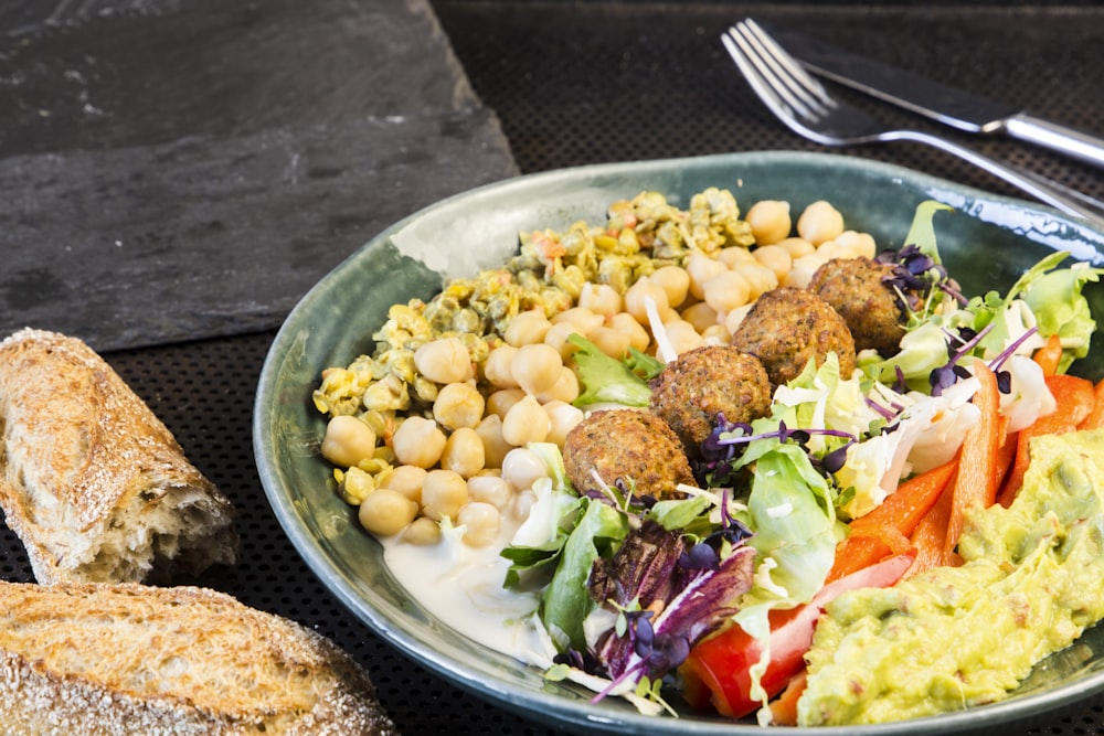 a plate of food with bread and salad