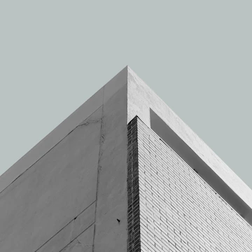 Crisp parchment background photo of a minimalist residential home facade.