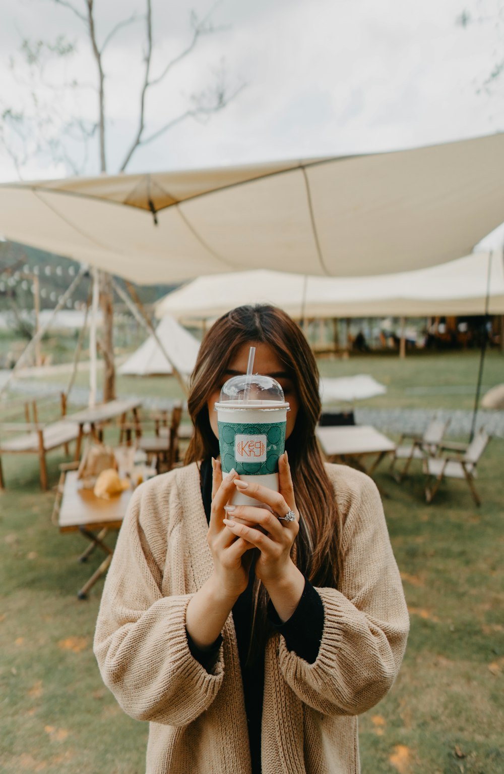 a woman taking a picture of herself with a camera