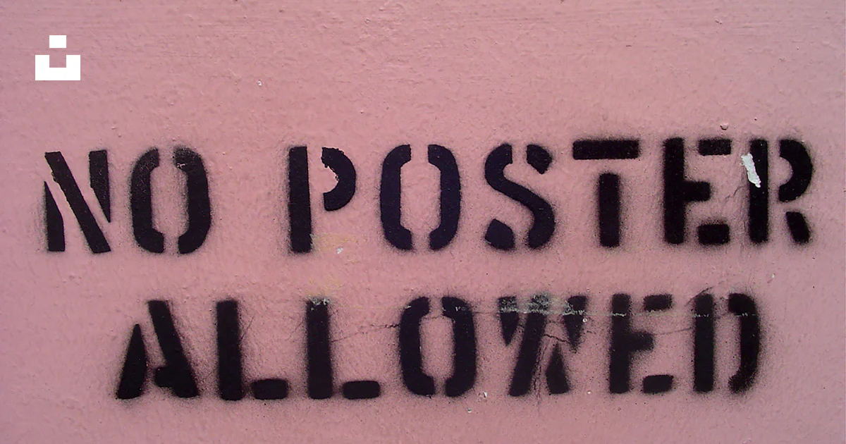 A sign that says no poster allowed on a pink wall photo – Free ...