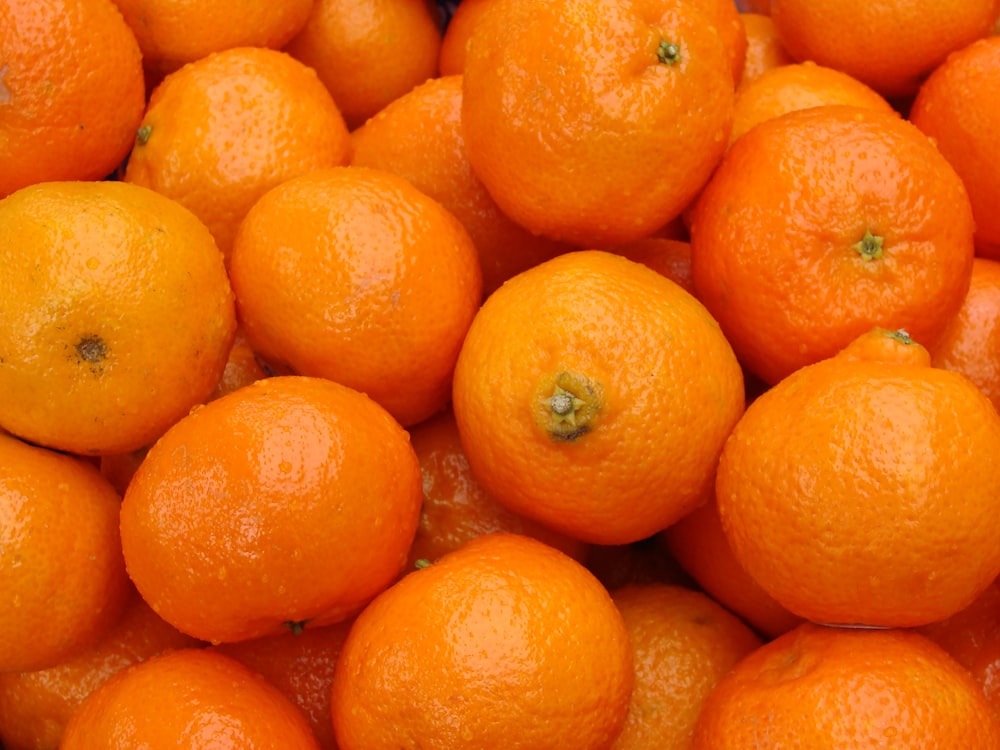 a pile of oranges sitting next to each other