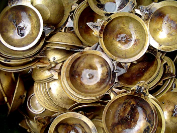 Stack of metal trays and serving platters with a brushed finish.