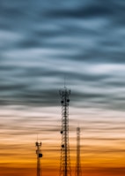 a couple of cell towers sitting next to each other