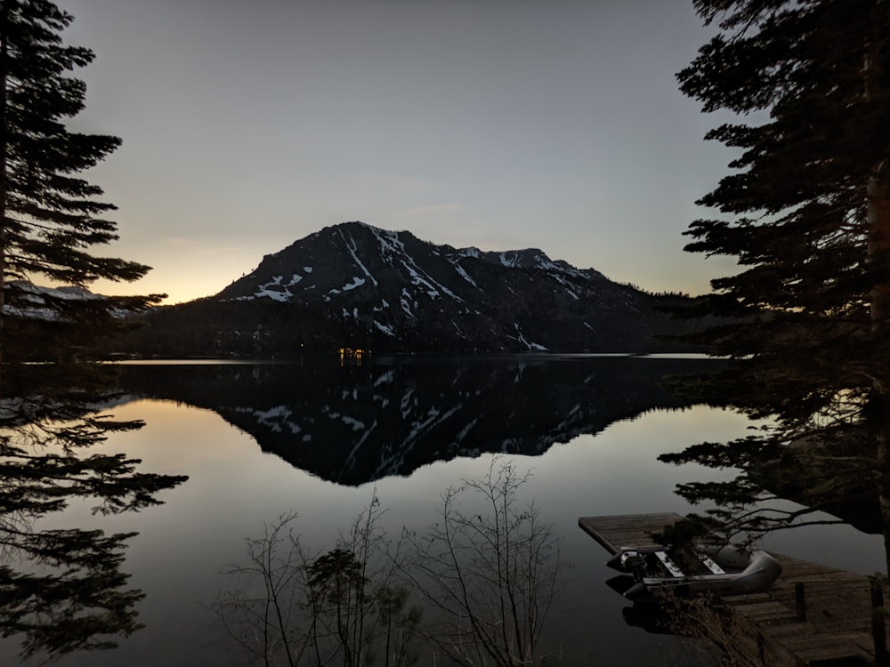 a lake with a mountain in the background