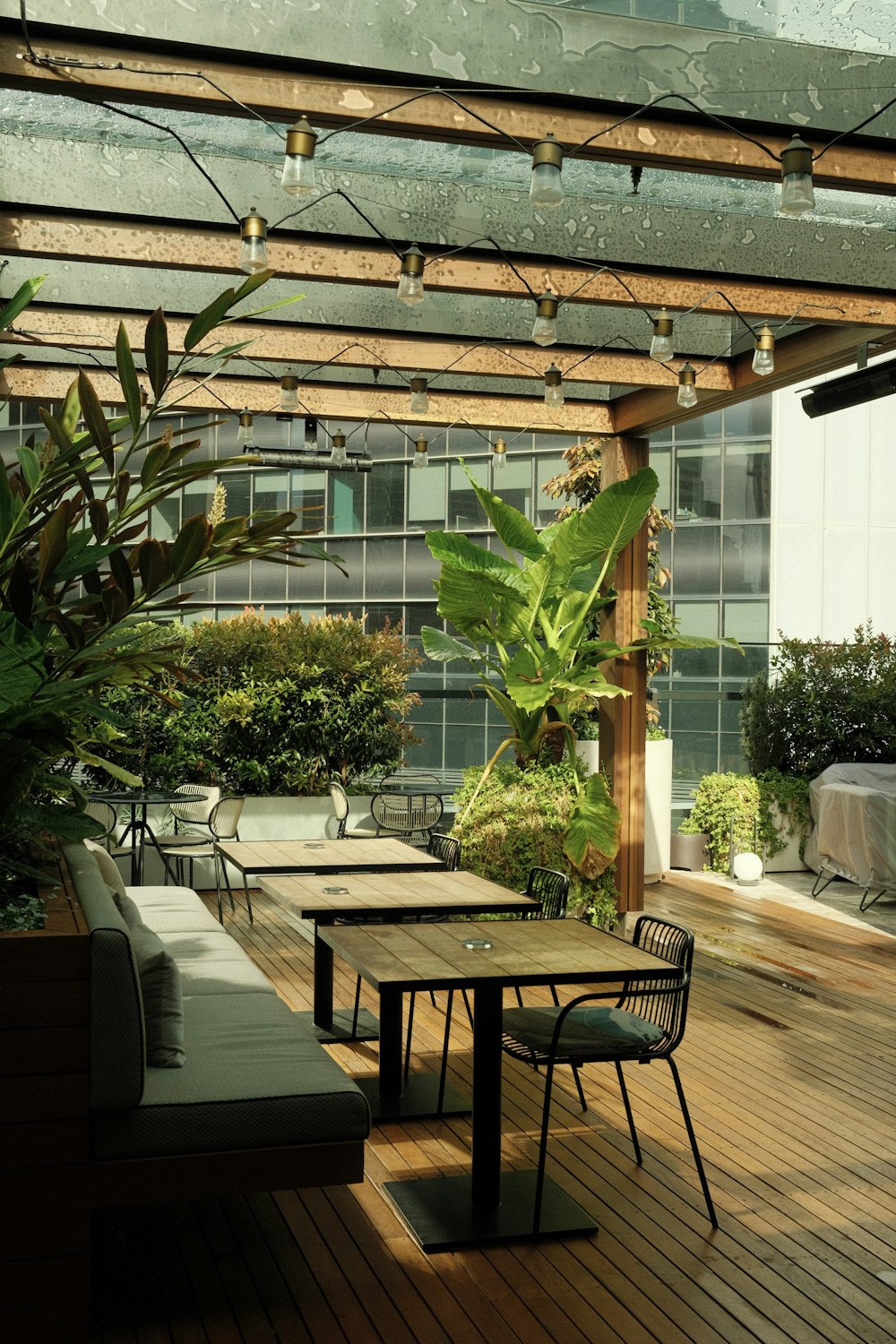 a wooden deck with a table and chairs