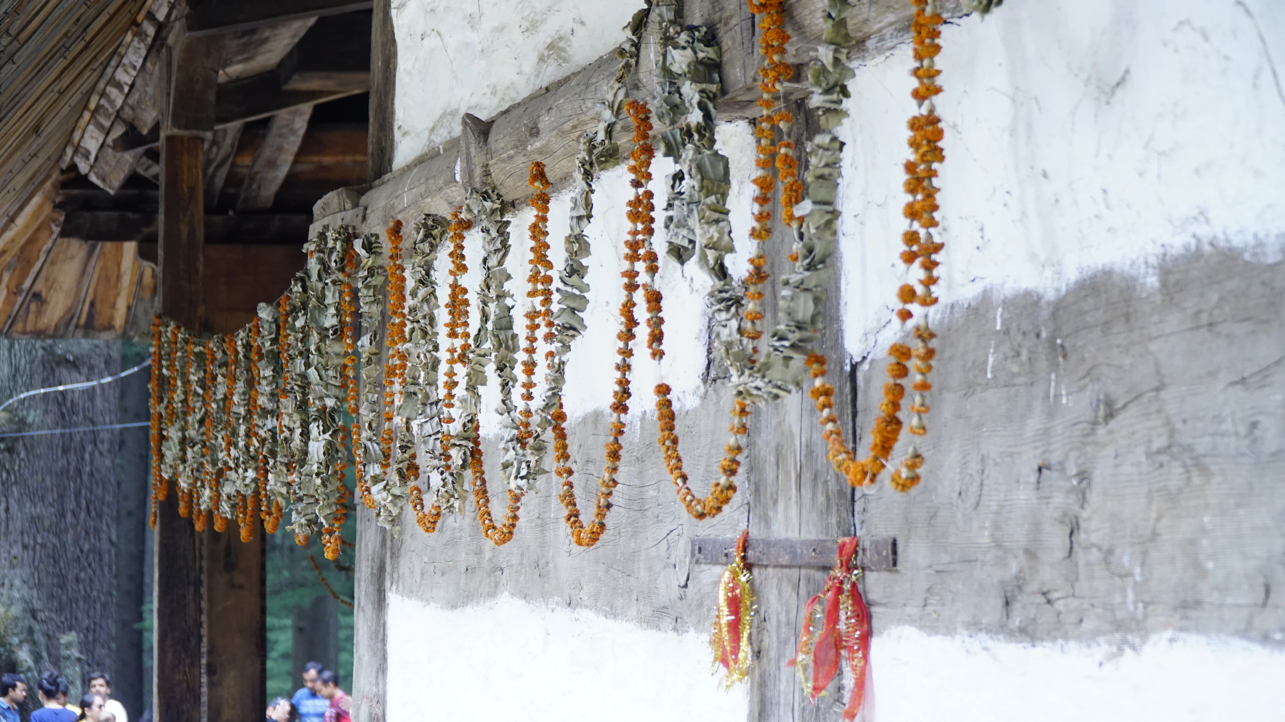 Visitors outside the wooden pagoda-style Hidimba Devi Temple in Old Manali, Himachal Pradesh
