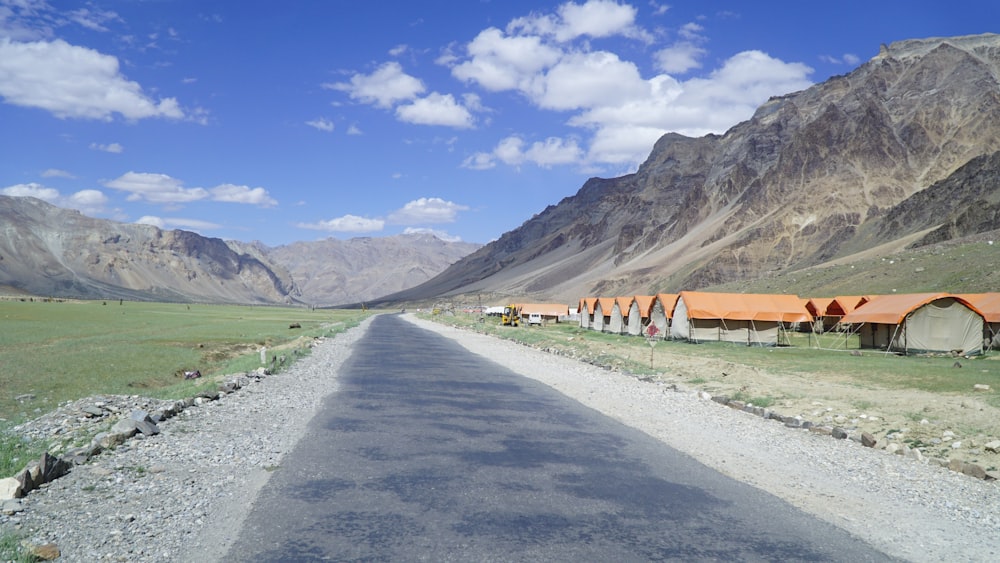 a long road with a mountain in the background