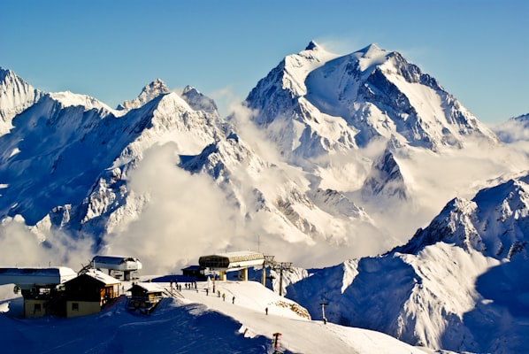 Snow-covered peaks in the French Alps under a clear sky