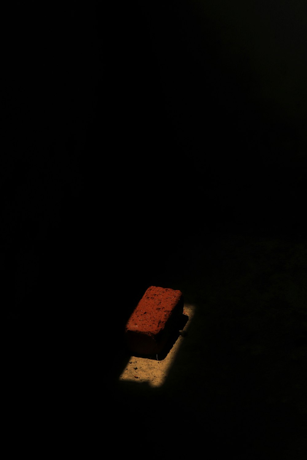 a red object is sitting in the dark