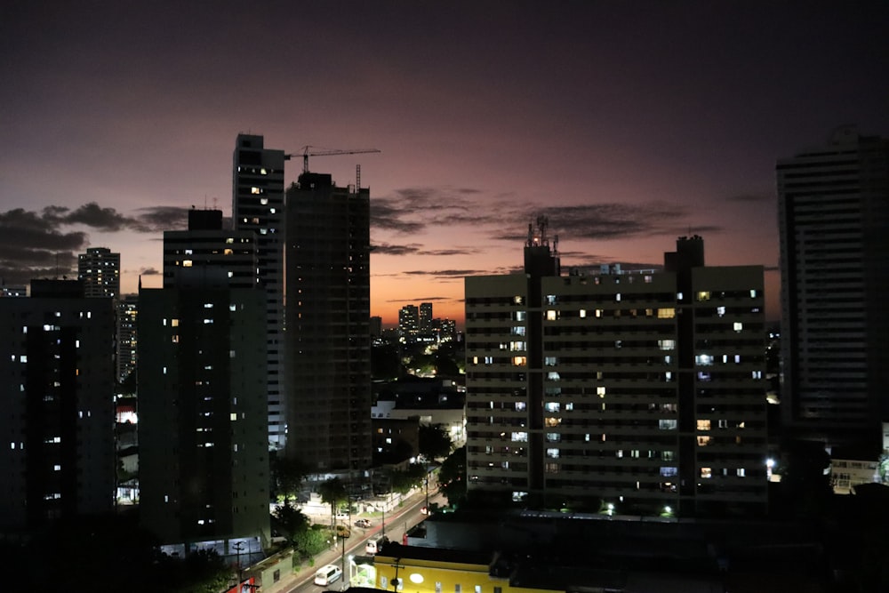 a view of a city at night from a high rise building