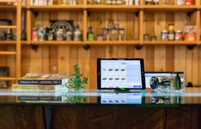 a tablet computer sitting on top of a glass table