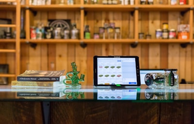 a tablet computer sitting on top of a glass table
