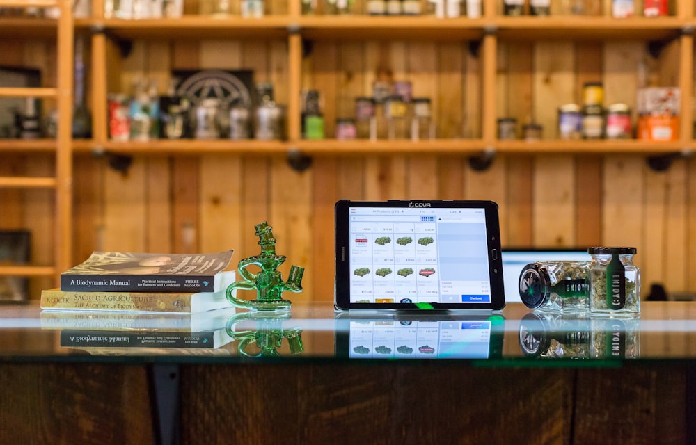 a tablet computer sitting on top of a glass table