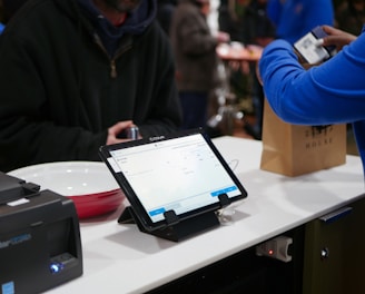 a tablet computer sitting on top of a table