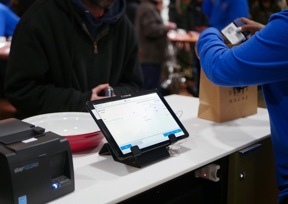 a tablet computer sitting on top of a table