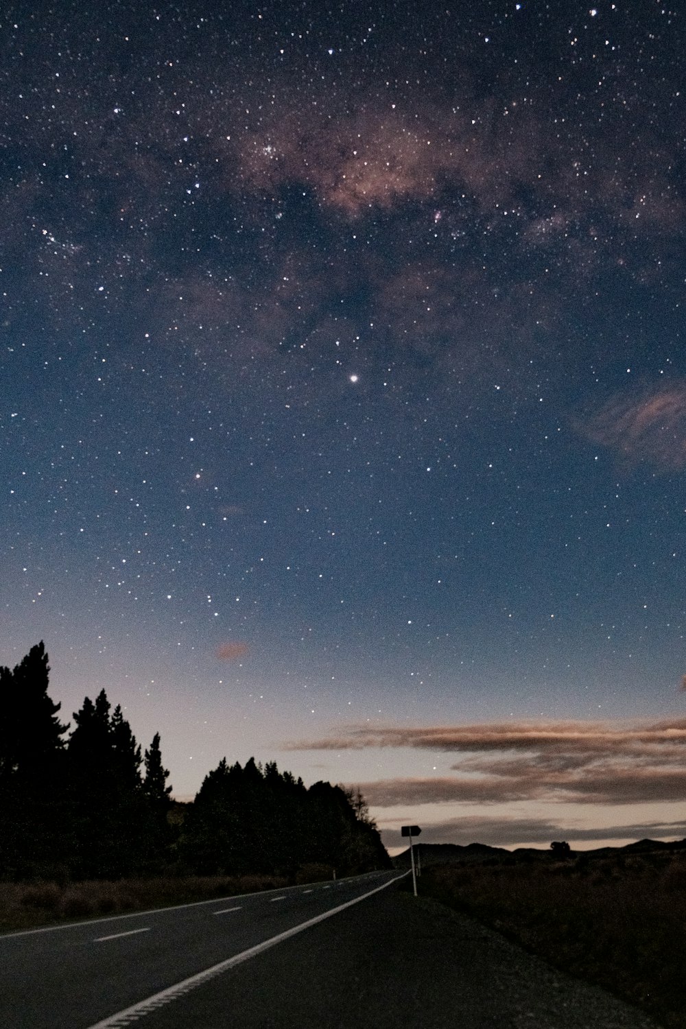 the night sky is filled with stars and clouds