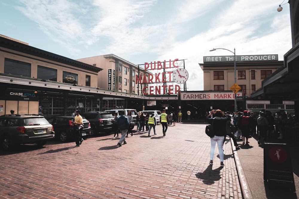 a group of people walking down a brick street