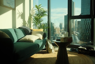a living room filled with furniture and a large window