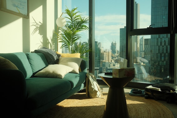 a living room filled with furniture and a large window