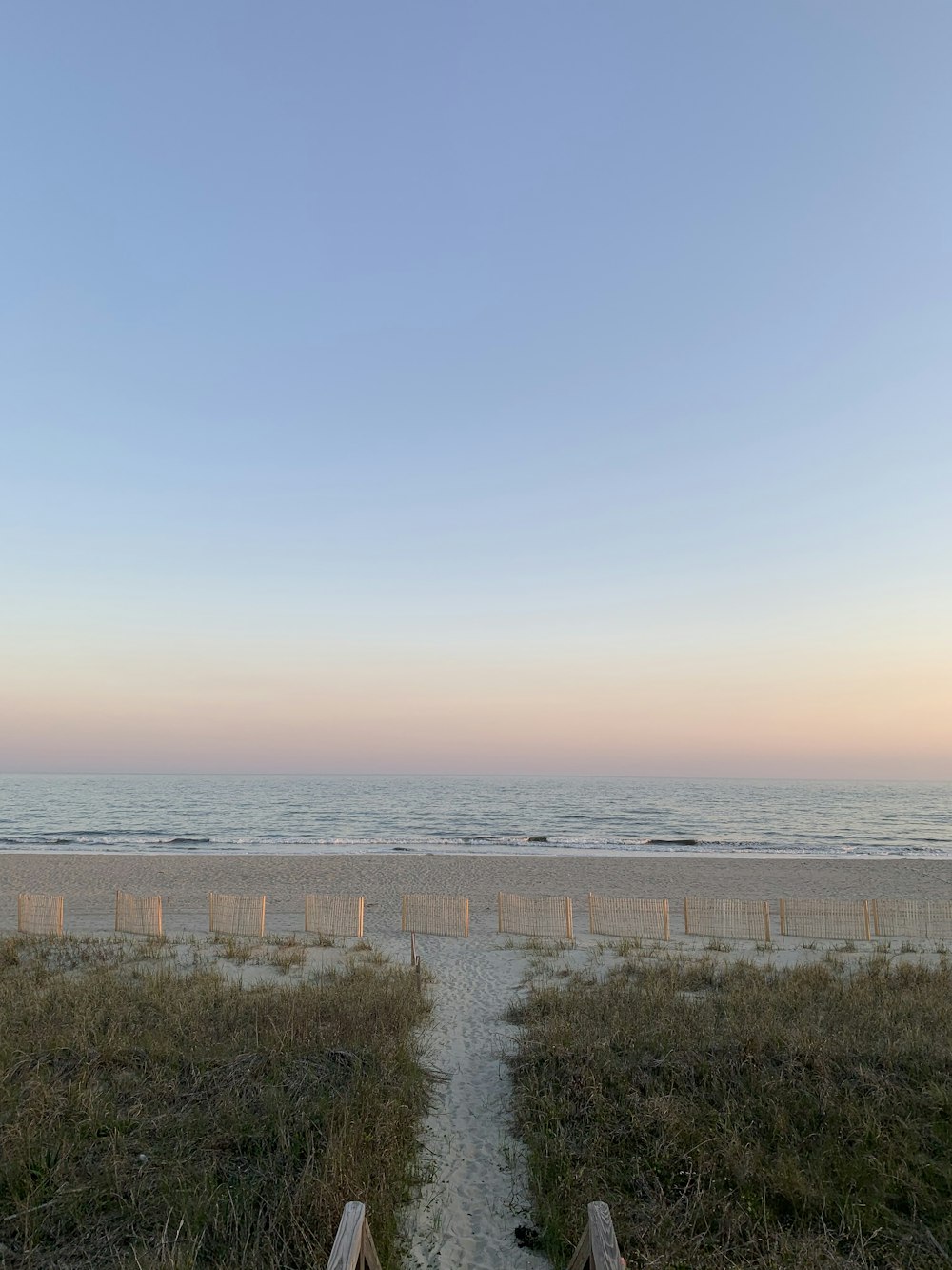 a path leading to the beach leading to the ocean