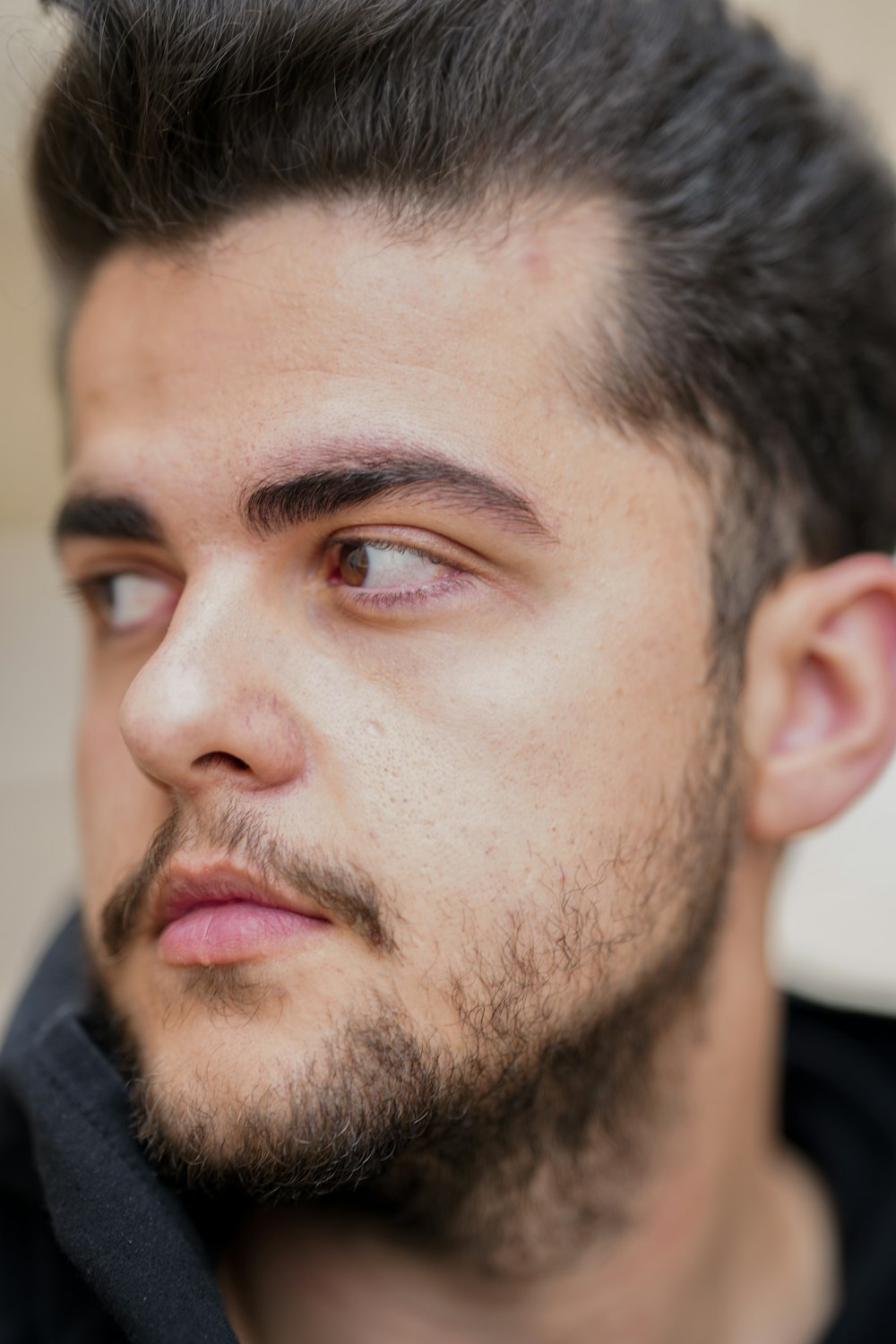 a close up of a person with a beard