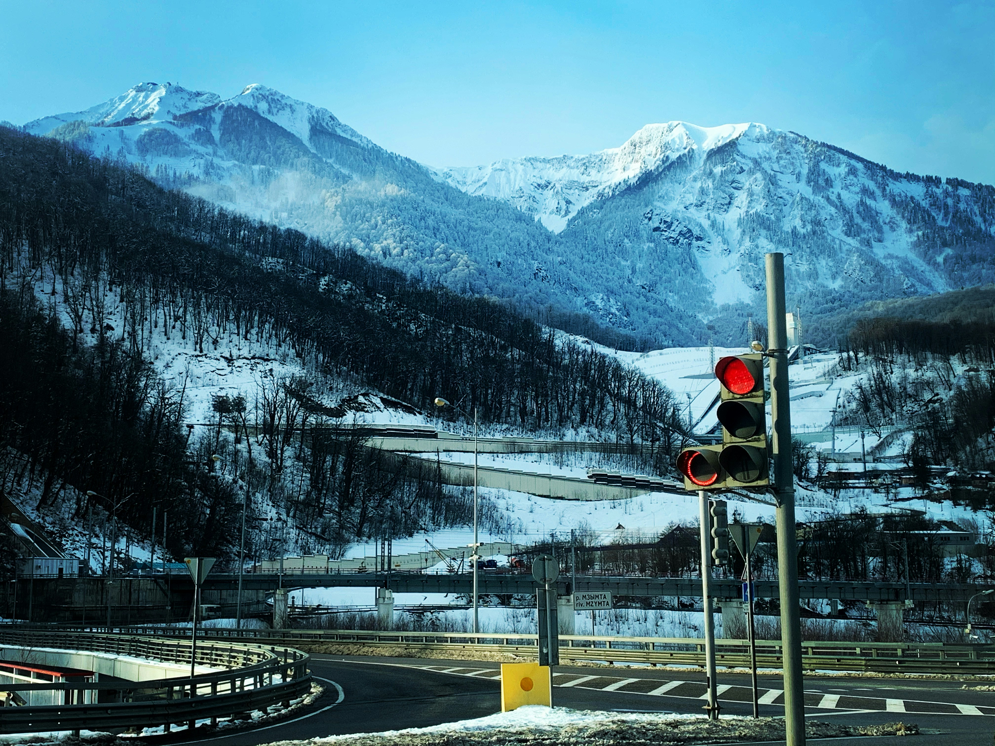 a traffic light sitting on the side of a road