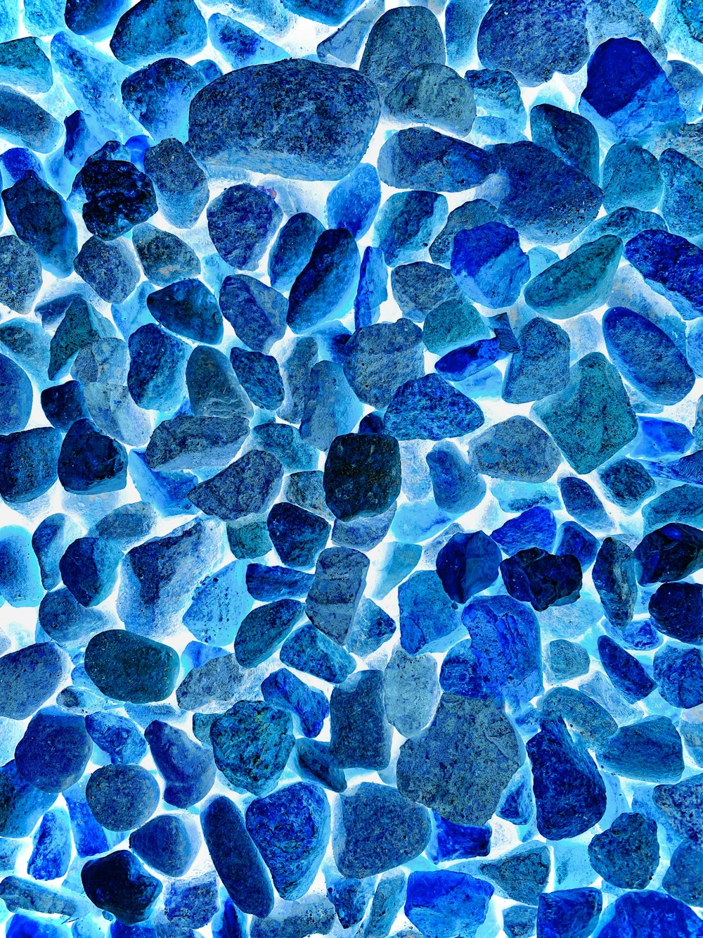 a close up of a blue rock wall
