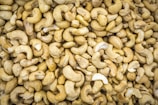 a pile of cashews sitting next to each other